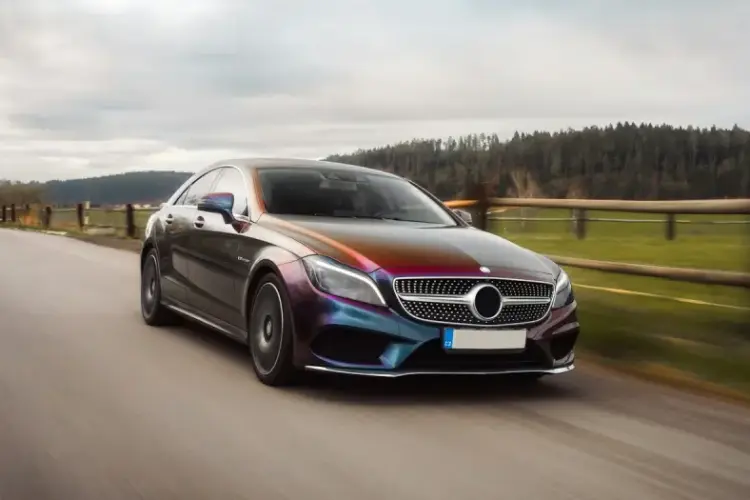 photo of a car slightly blurred to indicate it travelling at speed